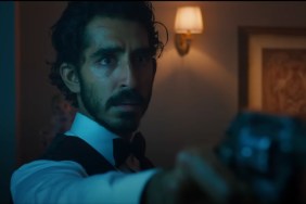 Dev Patel points a gun in Monkey Man.